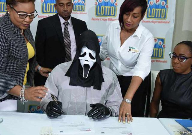 Lottery winner collects prize in a ‘Scream’ mask